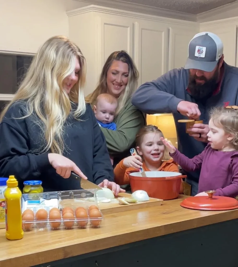 picture of family cooking together in their kitchen